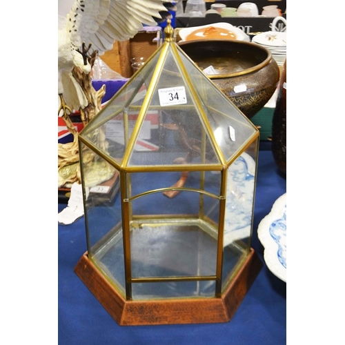 34 - A hexagonal vivarium,  brass persian style bowl on folding stand, a wooden vase and a terracotta vas... 