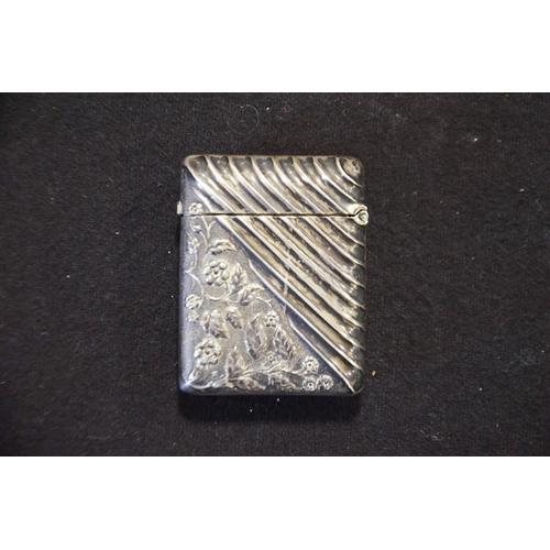 219 - Silver vesta case, with embossed flower and leaves and diagonal embossed stripes, Akers & Co Birming... 