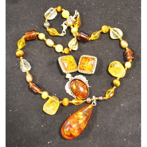 242 - Amber teadrop pendant on citrine and pearl link chain; a pair of amber silver mounted cushion shaped... 