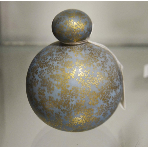 316 - A Royal Worcester scent bottle and stopper, globe form  with gilded seaweed decoration to a powder b... 