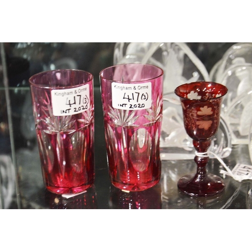 417 - A ruby flashed glass liqueur on knopped stem and two tumblers.  (3)