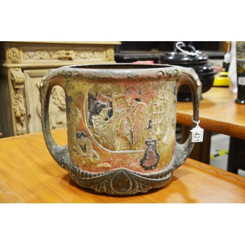 431 - A Bretby eathenware twin-handled vase, moulded in relief with oriental figures, the reverse with a h... 