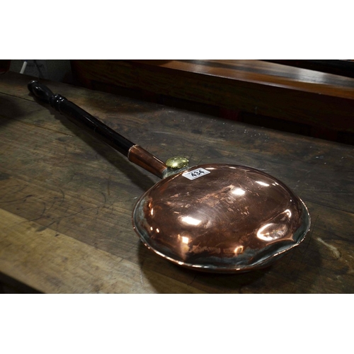 434 - A copper warming pan with turned ebonised handle.