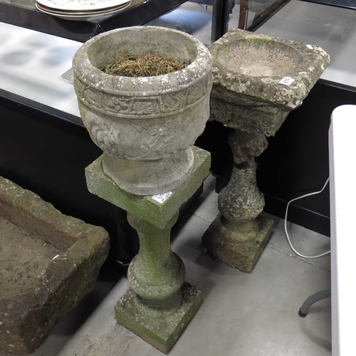 679 - A cast stone bird bath on baluster column and stepped base, and a cast stone jardiniere on baluster ... 