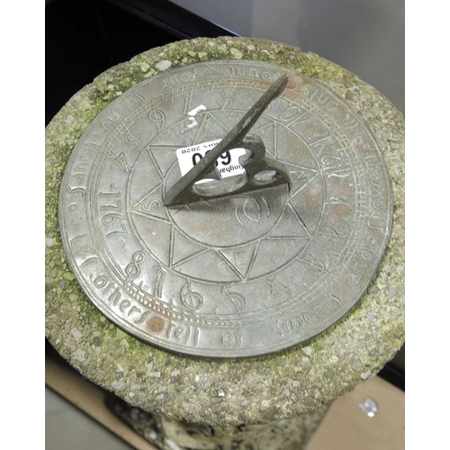 680 - A cast brass sundial on cast stone column with fruiting ivy.