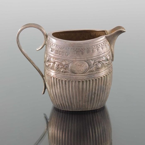74 - A Victorian silver jug, William Hutton, London 1884, oval barrel form, half fluted below  band of em... 