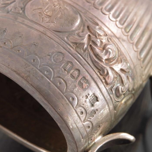 74 - A Victorian silver jug, William Hutton, London 1884, oval barrel form, half fluted below  band of em... 