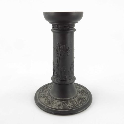 900 - A pair of Wedgwood black basalt candlesticks, early 19th century, Tuscan column form, decorated with... 