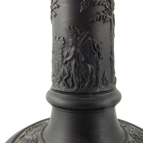 900 - A pair of Wedgwood black basalt candlesticks, early 19th century, Tuscan column form, decorated with... 