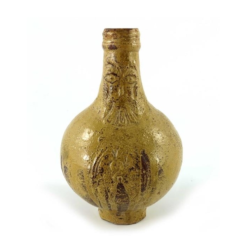 902 - A 17th century or earlier Bartmannkrug or Bellarmine jug, tope glazed with face mask above a floral ... 