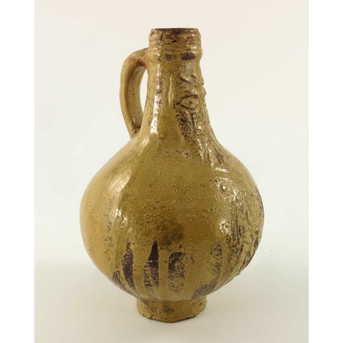 902 - A 17th century or earlier Bartmannkrug or Bellarmine jug, tope glazed with face mask above a floral ... 
