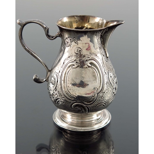 113 - A George II silver cream jug, William Coles, London 1739, baluster form with sparrow beak and S scro... 