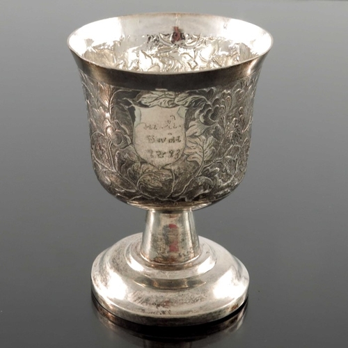 16 - A Chinese export silver goblet, MK circa 1890, the waisted cup body repousse decorated and chased wi... 