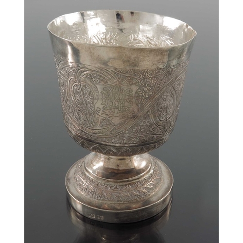 17 - A Chinese export silver goblet, TM, rounded beaker form with stepped foot, repousse embossed in the ... 