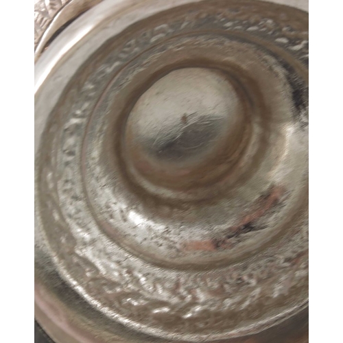17 - A Chinese export silver goblet, TM, rounded beaker form with stepped foot, repousse embossed in the ... 