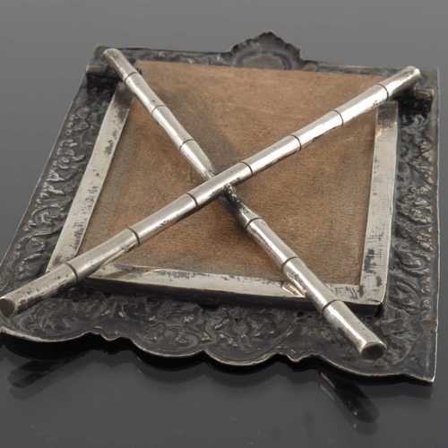 22 - A Chinese white metal photo frame, circa 1900, rectangular with heart shaped aperture, embossed and ... 