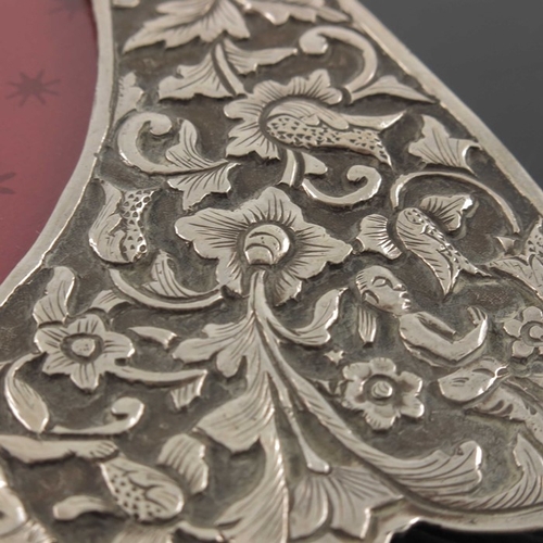 22 - A Chinese white metal photo frame, circa 1900, rectangular with heart shaped aperture, embossed and ... 