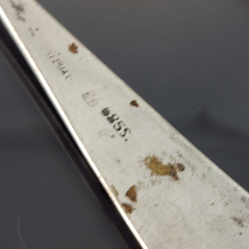 23 - A Latvian silver butter knife, CTB, Riga 1888, ogee edged spade blade, with hollow handle, together ... 
