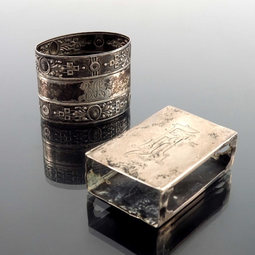 26 - An Imperial Russian silver match box case, together with a Continental silver napkin ring, Russian i... 