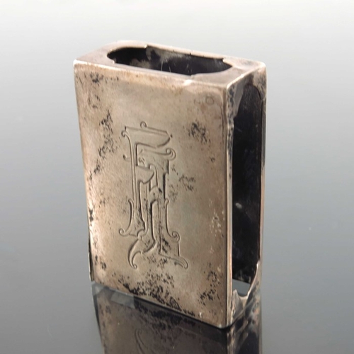 26 - An Imperial Russian silver match box case, together with a Continental silver napkin ring, Russian i... 