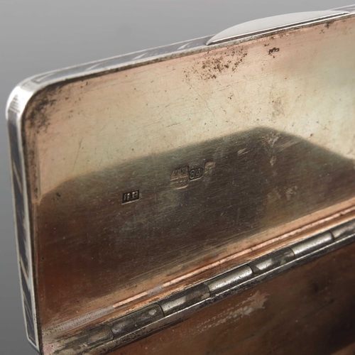 33 - An Imperial Russian silver and niello enamelled snuff box, Moscow 1852, cuboid form, decorated with ... 