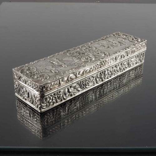 47 - A Dutch silver box, Amsterdam, cuboid form, embossed with village scenes within foliate scroll groun... 