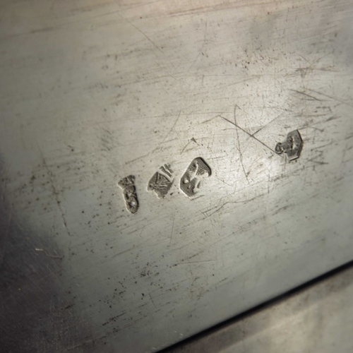 47 - A Dutch silver box, Amsterdam, cuboid form, embossed with village scenes within foliate scroll groun... 