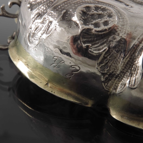 50 - A 17th century German silver and parcel gilt twin handled wine taster or dish, Paul Hedel Hofer, Bre... 
