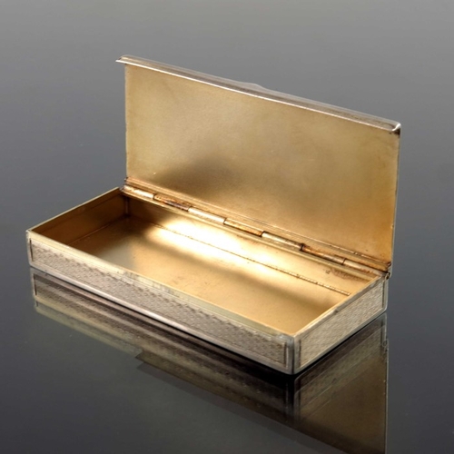 53 - A French silver snuff box, circa 1890, rectangular section, engine turned and chased with floral gar... 