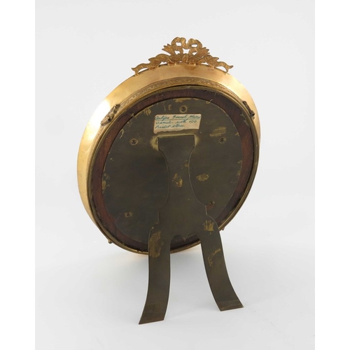 337 - A 19th century French gilt brass and paste set mirror, bevelled oval form, tooled and chased with ri... 