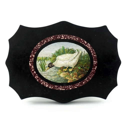338 - A 19th century micro mosaic paperweight, the central oval with a duck at the edge of a pond, within ... 