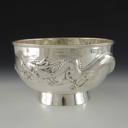 14 - A Chinese export silver bowl, Wang Hing, Canton circa 1900, rounded footed form, embossed and chased... 