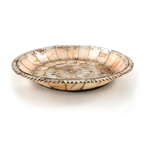 495 - An Indian mother of pearl dish, possibly Gujarat, circular form with jagged edge rim, pinned section... 