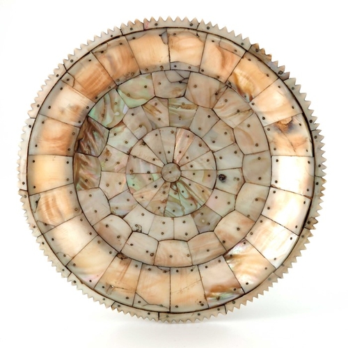 495 - An Indian mother of pearl dish, possibly Gujarat, circular form with jagged edge rim, pinned section... 
