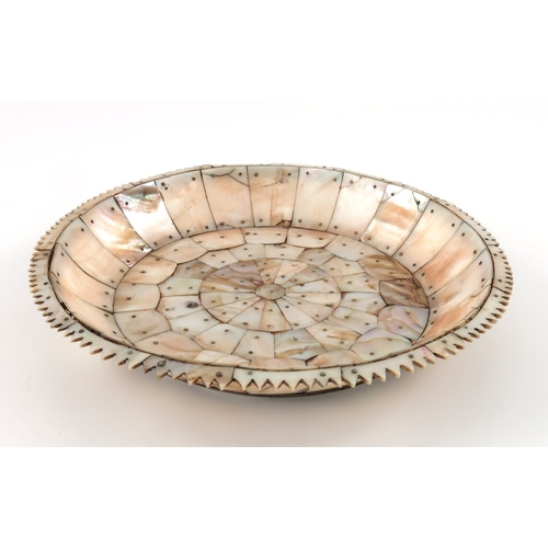495 - An Indian mother of pearl dish, possibly Gujarat, circular form with jagged edge rim, pinned section... 
