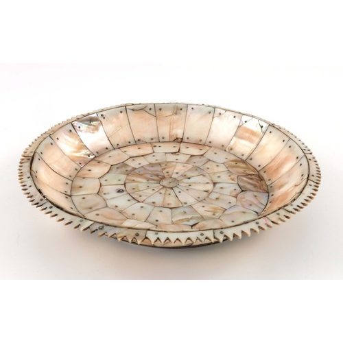 495 - An Indian mother of pearl dish, possibly Gujarat, circular form with jagged edge rim, pinned section... 
