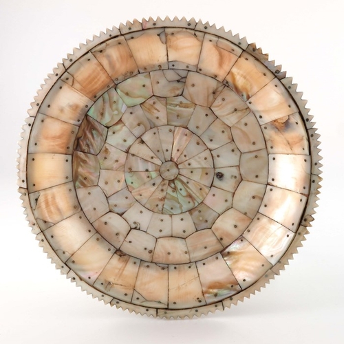 495 - An Indian mother of pearl dish, possibly Gujarat, circular form with jagged edge rim, pinned section... 