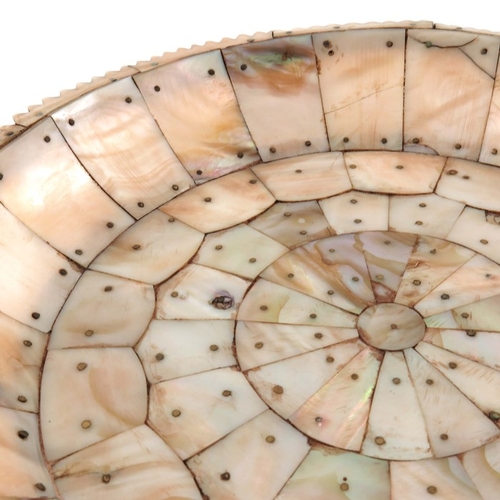 495 - An Indian mother of pearl dish, possibly Gujarat, circular form with jagged edge rim, pinned section... 