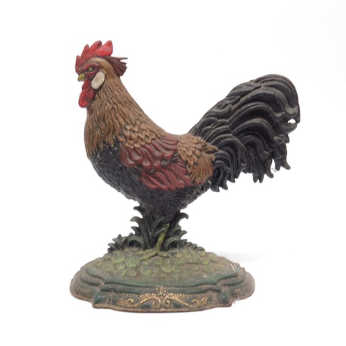 23 - A cast metal doorstop in the form of a cockerel.