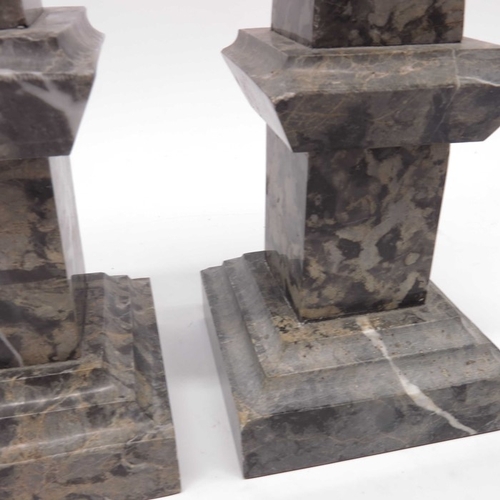 38 - A pair of marble obelisks. square sectional form  on stepped bases, 40cm high  (2)