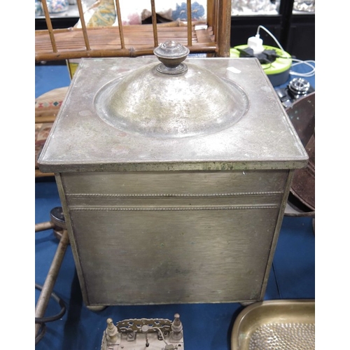 69 - A Brass coal scuttle, square neo-classical form on four squat bun feet, a brass lid, a copper helmet... 