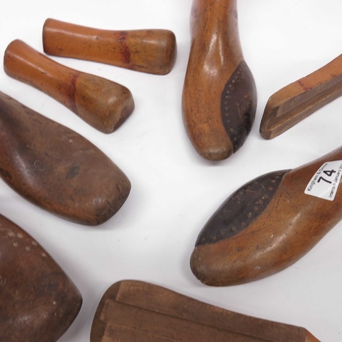 74 - Two pairs of wooden shoe stretchers, a hat jack, a vintage table tennis net and a pair of faux book ... 