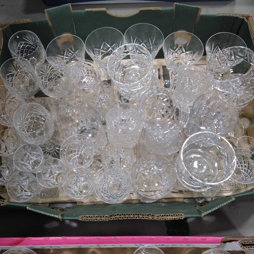 89 - Cut glass decanters, and assorted but glass drinking glassware.  (2 trays)