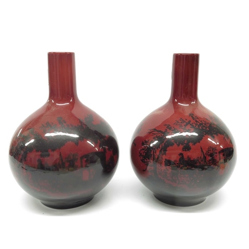 917 - A pair of Royal Doulton Flambe vase, bottle form, Woodcut 1878, 26cm high  (2)