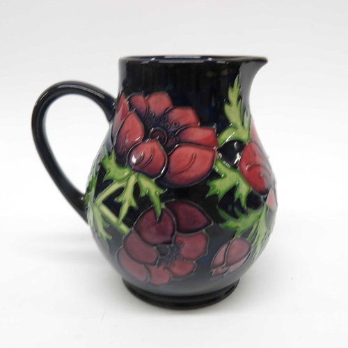 920 - A Moorcroft Anemone on blue jug, baluster form, impressed mark, 15cm high