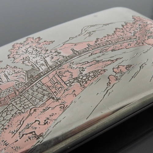 3 - A Japanese silver and mixed metal cigarette case, circa 1930s, incised with a landscape of mountains... 