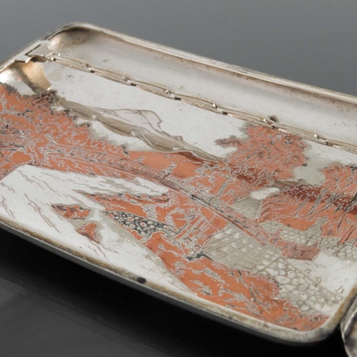 3 - A Japanese silver and mixed metal cigarette case, circa 1930s, incised with a landscape of mountains... 