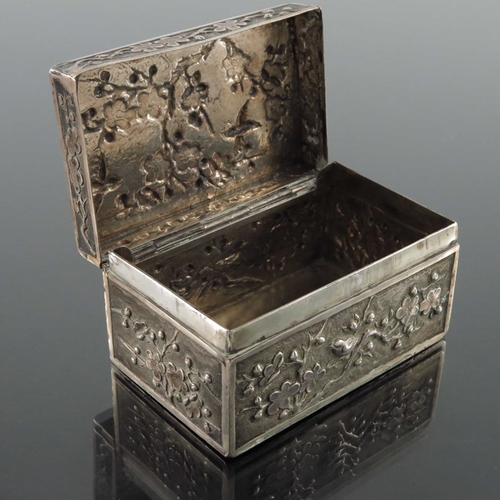 4 - A Chinese silver box, Luen Wo, Shanghai circa 1900, cuboid form, embossed and chased with flowering ... 