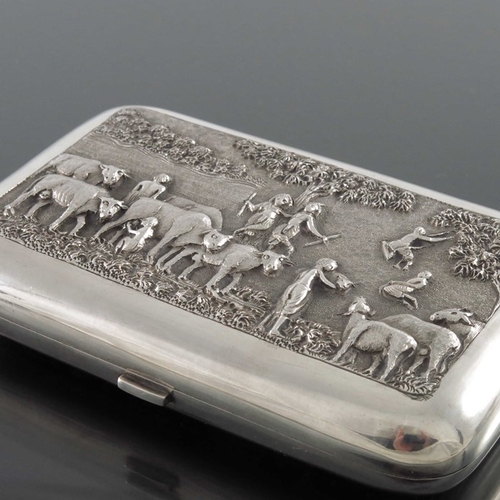 7 - An Indian white metal cigar case, circa 1910, repousse embossed and chased with Hindu figures and co... 