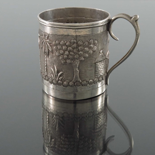 8 - An Indian white metal mug, late 19th century, cylindrical form, repousse embossed and chased with tr... 